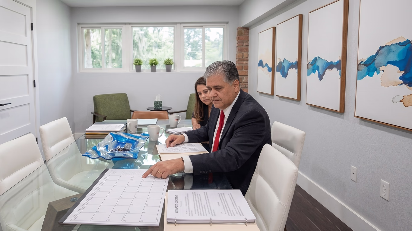 Orlando auto accident attorney explaining Florida insurance settlement timelines and the 20-day payout rule to a client.