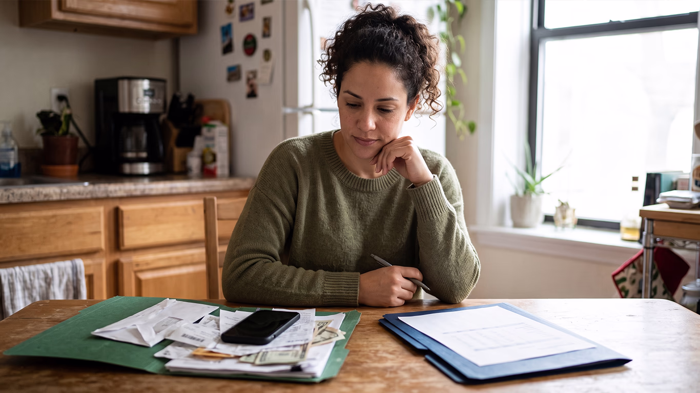 Orlando resident weighing the choice between bankruptcy and debt settlement to resolve overwhelming debt